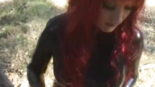 Latex babes Aradia and Krissy engage in lesbian BDSM outdoor