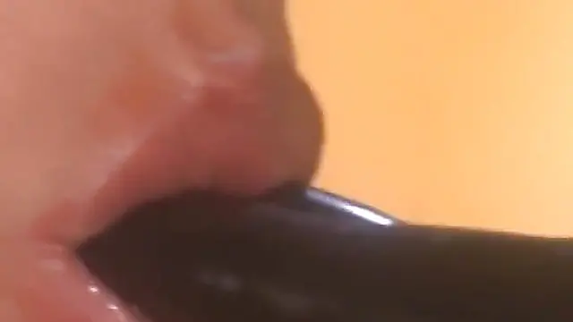  Busty latex queen controls young dark-haired slave