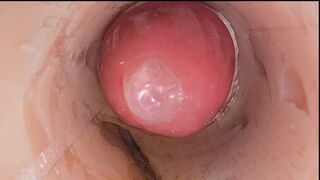 The camera in the deep pussy records a huge ejaculation of sperm into the condom