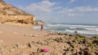 Horny girl and guy undress on a public beach and masturbate - risky