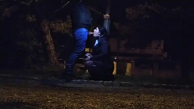 Cock sucking under the night light